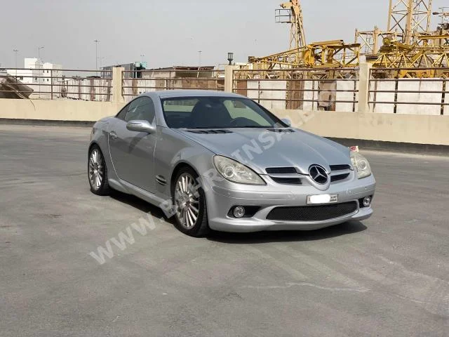 Mercedes-Benz  SLK-Class  55 AMG  2006  Convertible  Automatic  4  245,700  RWD  Silver  Gasoline