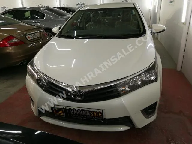 Toyota  Corolla  XLI  2014  Sedan  Automatic  4  58,000  FWD  White  Gasoline