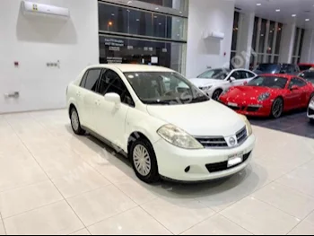 Nissan  Tiida  2009  Sedan  Automatic  4  185,050  FWD  White  Gasoline