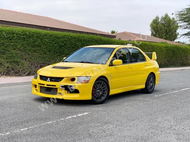 Mitsubishi  Lancer  Evolution MR  2006  Sedan  Manual  4  143,300  FWD  Yellow  Gasoline