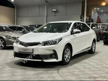 Toyota  Corolla  XLI  2018  Sedan  Automatic  4  87,000  FWD  White  Gasoline