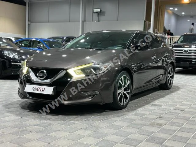 Nissan  Maxima  2016  Sedan  Automatic  6  90,000  FWD  Brown  Gasoline
