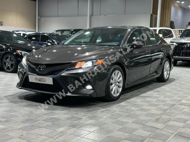 Toyota  Camry  LE  2019  Sedan  Automatic  4  70,000  FWD  Brown  Gasoline