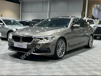 BMW  5-Series  530i  2017  Sedan  Automatic  4  64,000  RWD  Gold  Gasoline