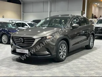 Mazda  CX  9  2018  SUV  Automatic  4  130,000  FWD  Brown  Gasoline