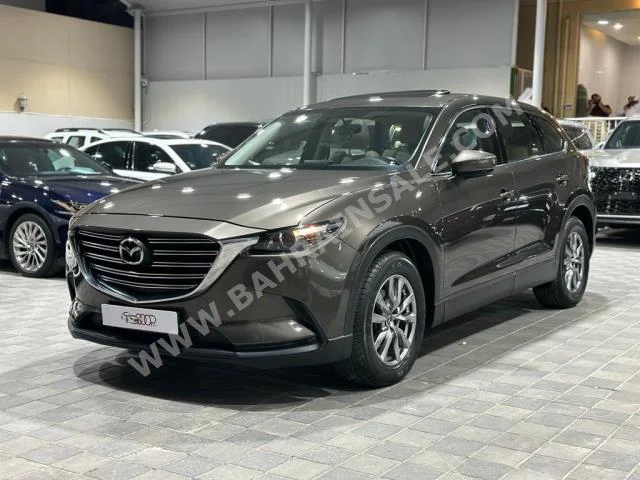 Mazda  CX  9  2018  SUV  Automatic  4  130,000  FWD  Brown  Gasoline