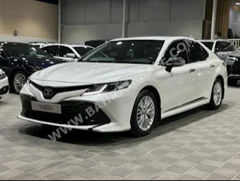 Toyota  Camry  LE  2018  Sedan  Automatic  4  85,000  FWD  White  Gasoline