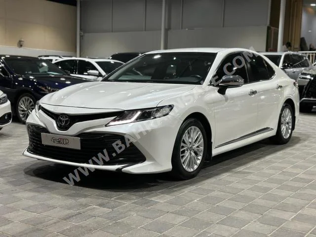 Toyota  Camry  LE  2018  Sedan  Automatic  4  85,000  FWD  White  Gasoline