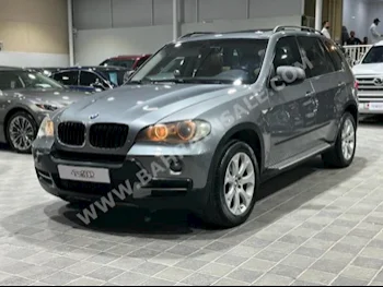 BMW  X-Series  5  2009  SUV  Automatic  6  140,000  4WD  Gray  Gasoline