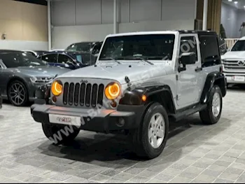 Jeep  Wrangler  Sahara  2011  SUV  Automatic  6  165,000  4WD  Silver  Gasoline