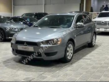Mitsubishi  Lancer  EX  2012  Sedan  Automatic  4  260,000  FWD  Silver  Gasoline