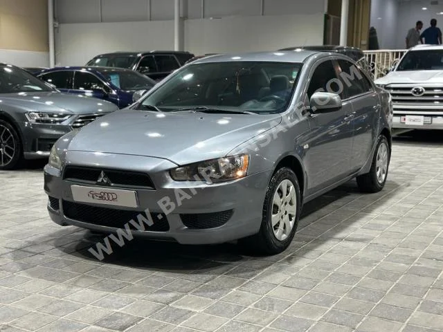 Mitsubishi  Lancer  EX  2012  Sedan  Automatic  4  260,000  FWD  Silver  Gasoline