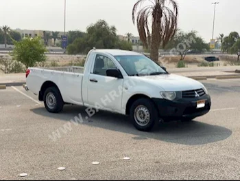 Mitsubishi  L 200  2014  Pick Up  Manual  4  230,650  RWD  White  Gasoline