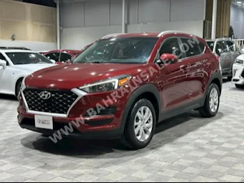 Hyundai  Tucson  2019  SUV  Automatic  4  56,000  RWD  Dark Red  Gasoline