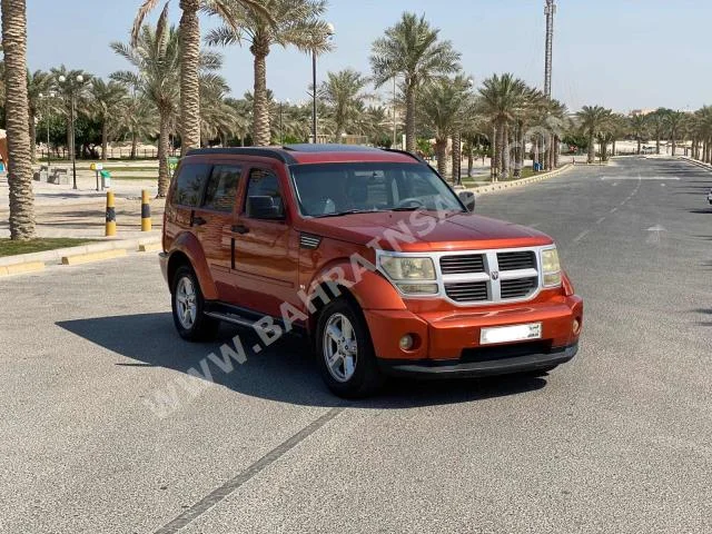 Dodge  Nitro  2009  SUV  Automatic  6  210,300  RWD  Orange  Gasoline