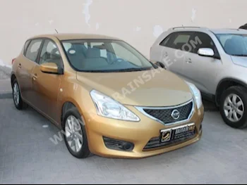 Nissan  Tiida  2014  Sedan  Automatic  4  71,000  FWD  Gold  Gasoline