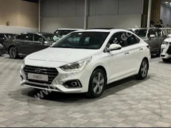 Hyundai  Accent  1.6  2019  Sedan  Automatic  4  165,000  FWD  White  Gasoline