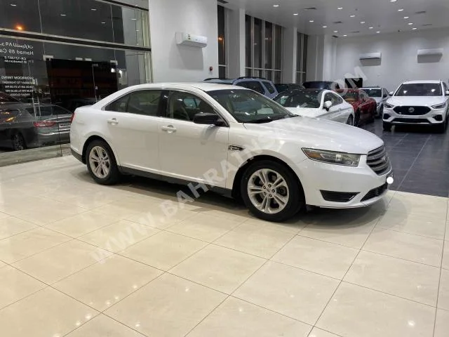 Ford  Taurus  2018  Sedan  Automatic  4  132,750  FWD  White  Gasoline