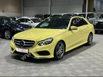 Mercedes-Benz  E-Class  300  2014  Sedan  Automatic  6  105,000  FWD  Yellow  Gasoline