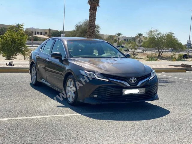 Toyota  Camry  GLE  2018  Sedan  Automatic  4  169,000  FWD  Brown  Gasoline