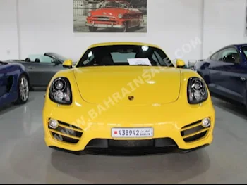 Porsche  Cayman  2014  Coupe / Sport  Automatic  6  14,000  AWD  Yellow  Gasoline