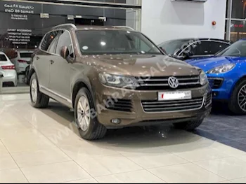 Volkswagen  Touareg  2014  SUV  Automatic  6  142,900  RWD  Brown  Gasoline