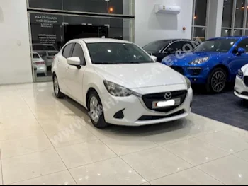 Mazda  Mazda 2  2016  Sedan  Automatic  4  137,700  FWD  White  Gasoline