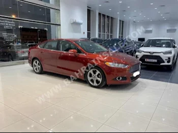 Ford  Fusion  2014  Sedan  Automatic  4  235,000  FWD  Orange  Gasoline