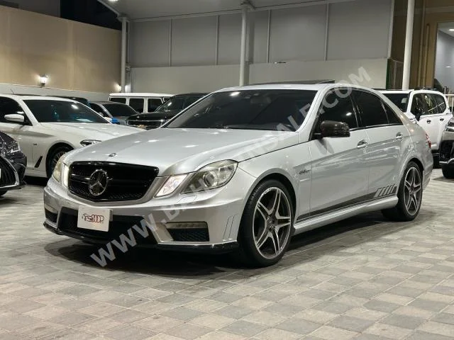 Mercedes-Benz  E-Class  63 AMG  2011  Sedan  Automatic  8  167,000  RWD  Silver  Gasoline
