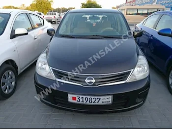 Nissan  Tiida  2012  Hatchback  Automatic  4  147,000  FWD  Black  Gasoline