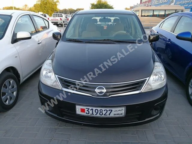 Nissan  Tiida  2012  Hatchback  Automatic  4  147,000  FWD  Black  Gasoline