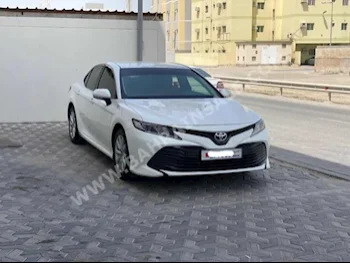 Toyota  Camry  LE  2018  Sedan  Automatic  4  104,500  FWD  White  Gasoline