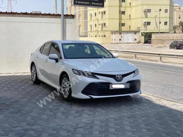 Toyota  Camry  LE  2019  Sedan  Automatic  4  96,400  FWD  White  Gasoline