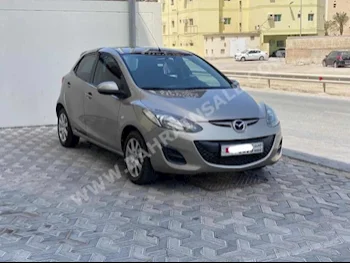 Mazda  Mazda 2  2014  Hatchback  Automatic  4  96,750  FWD  Gold  Gasoline