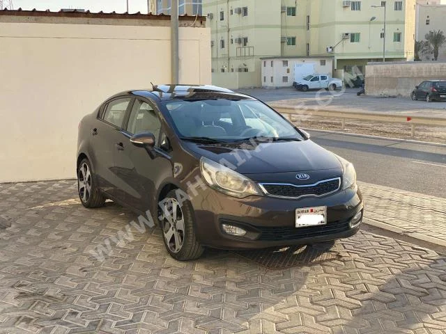 Kia  Rio  2013  Sedan  Automatic  4  136,000  FWD  Brown  Gasoline
