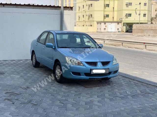Mitsubishi  Lancer  2004  Sedan  Automatic  4  319,750  FWD  Blue  Gasoline