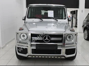 Mercedes-Benz  G-Class  500 AMG  2004  SUV  Automatic  8  100,000  4WD  Silver  Gasoline