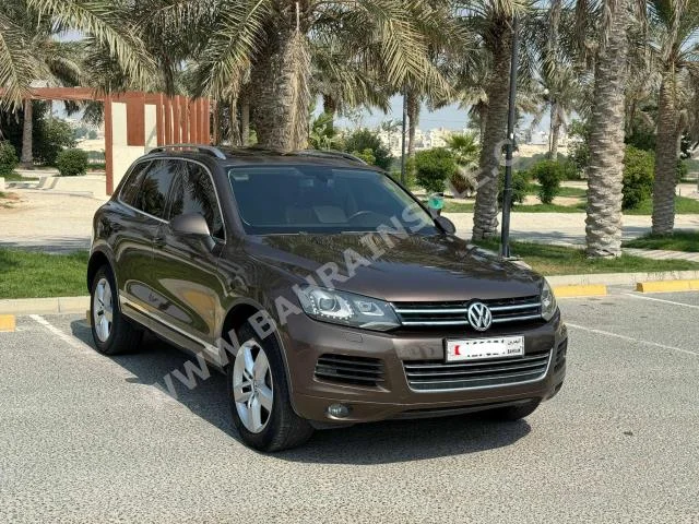 Volkswagen  Touareg  2014  SUV  Automatic  6  115,700  AWD  Brown  Gasoline
