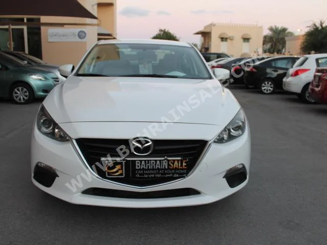 Mazda  Mazda 3  2015  Sedan  Automatic  4  64,000  FWD  White  Gasoline