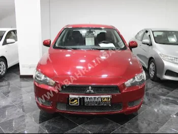 Mitsubishi  Lancer  2014  Sedan  Automatic  4  54,000  FWD  Red  Gasoline