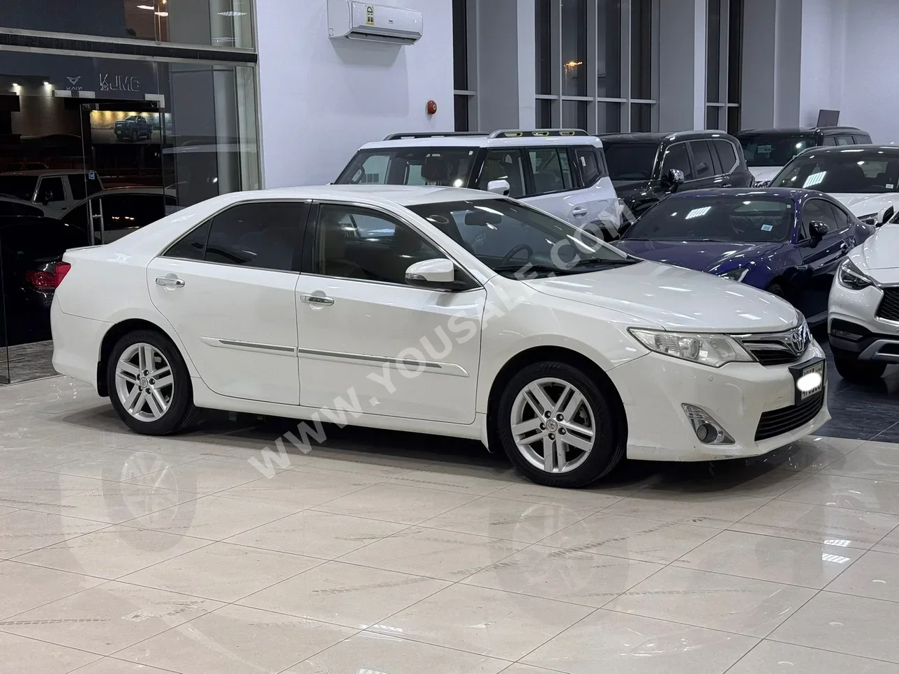 تويوتا  كامري  جي ال اكس  2014  اتوماتك  244,300 كم  4 سلندر  سيدان  أبيض