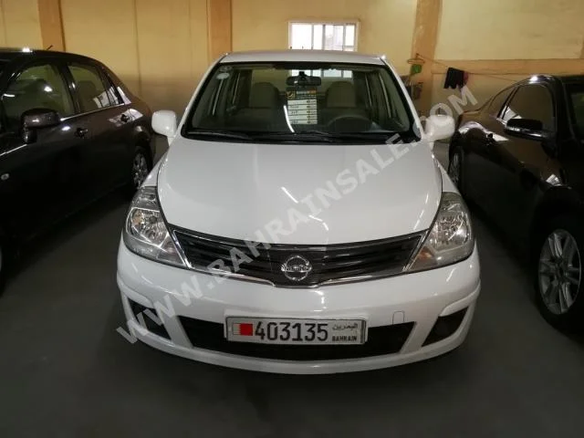 Nissan  Tiida  2011  Sedan  Automatic  4  117,000  FWD  White  Gasoline