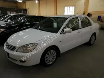 Mitsubishi  Lancer  2013  Sedan  Automatic  4  113,000  FWD  White  Gasoline