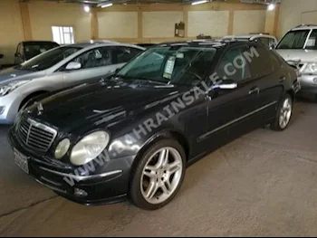 Mercedes-Benz  E-Class  500  2003  Sedan  Automatic  8  225,000  RWD  Dark Blue  Gasoline