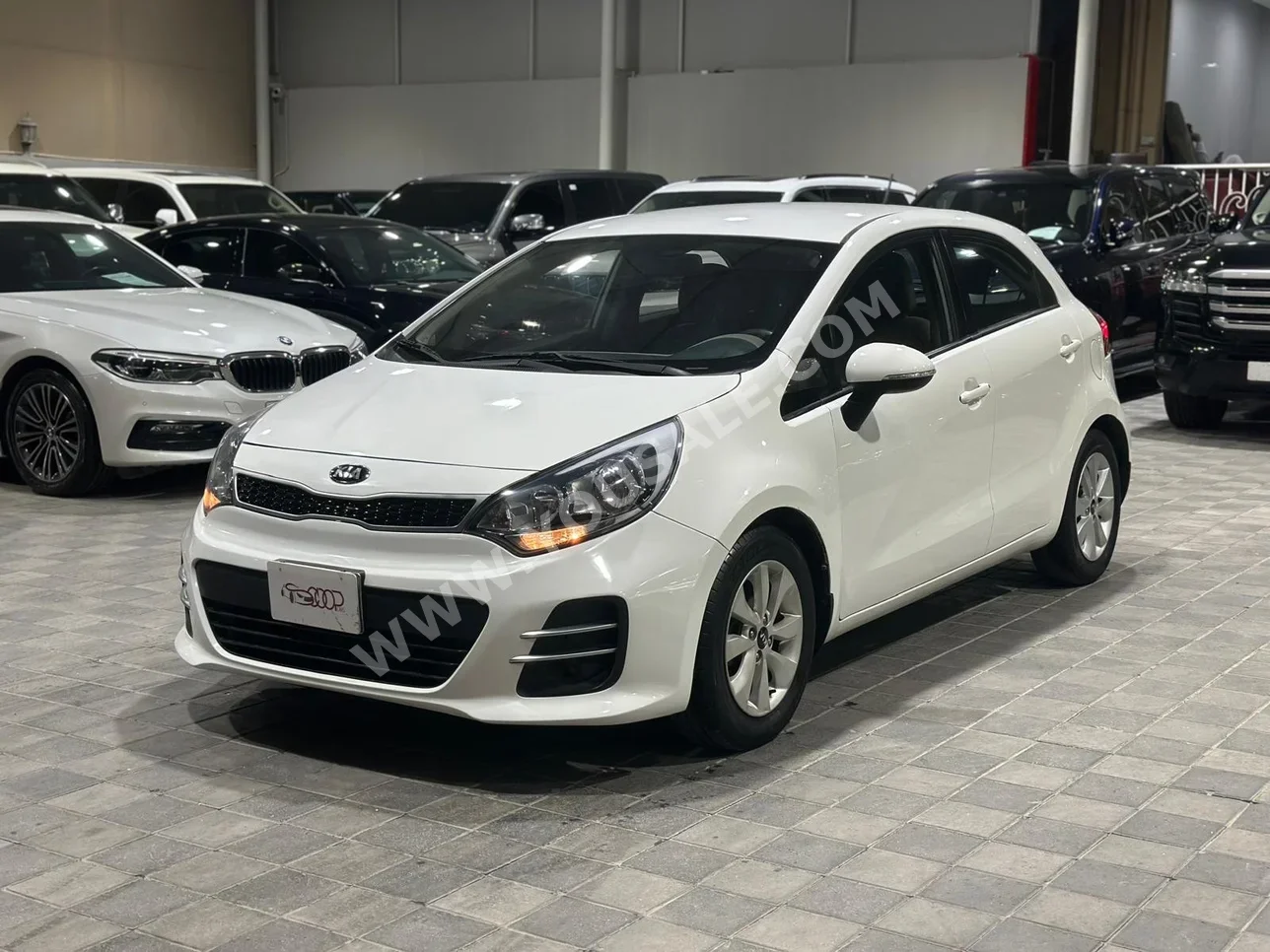 Kia  Rio  2016  Automatic  90,000 KM  4 Cylinder  Hatchback  White