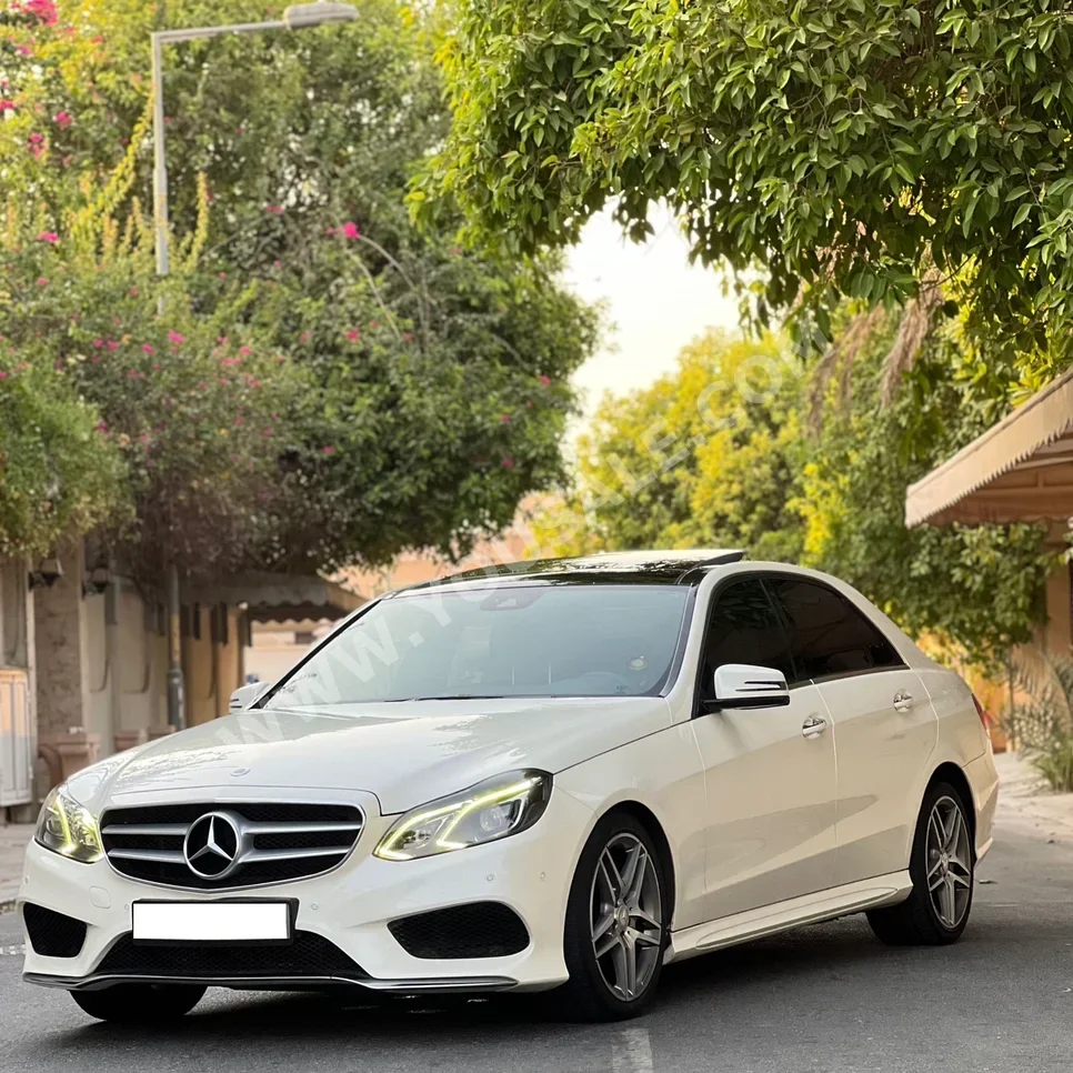 Mercedes-Benz  E-Class  300 AMG  2014  Automatic  167,000 KM  6 Cylinder  Sedan  White