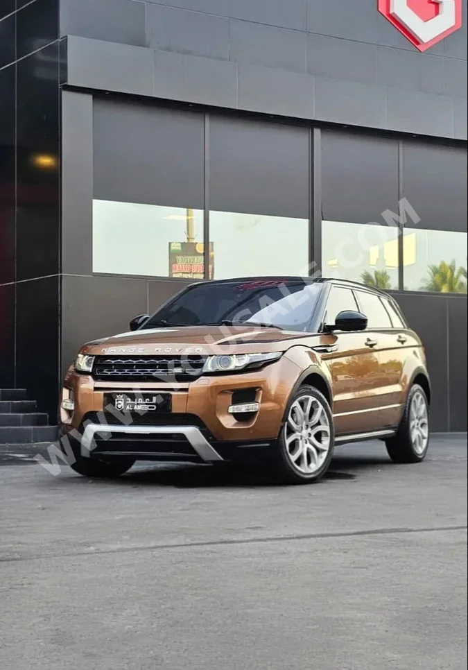 Land Rover  Evoque  2015  Automatic  128,000 KM  4 Cylinder  SUV  Black & Orange