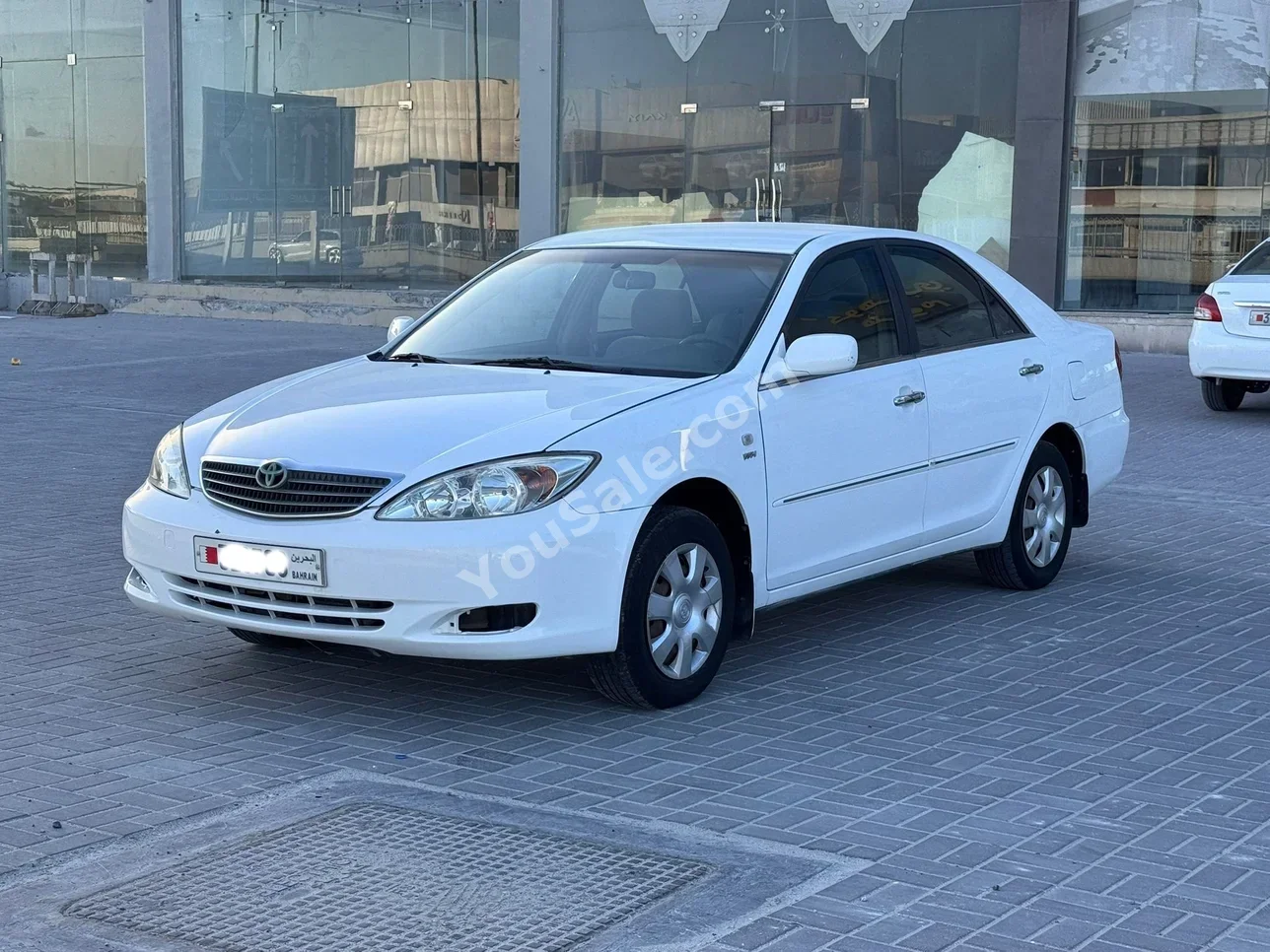 تويوتا كامري جي ال اي 2004 اتوماتك 288,000 كم 4 سلندر سيدان أبيض