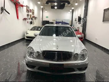 Mercedes-Benz  E-Class  55 AMG  2006  Sedan  Automatic  4  85,000  RWD  Silver  Gasoline