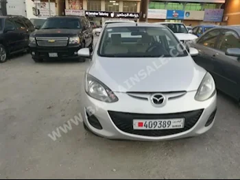 Mazda  Mazda 2  2012  Sedan  Automatic  4  90,000  FWD  Silver  Gasoline